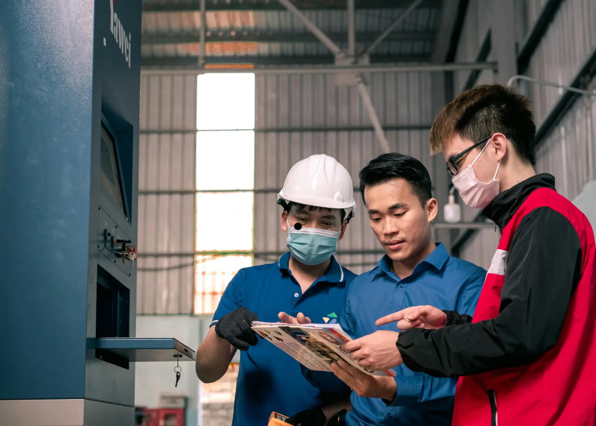 Team checking documentation against equipment