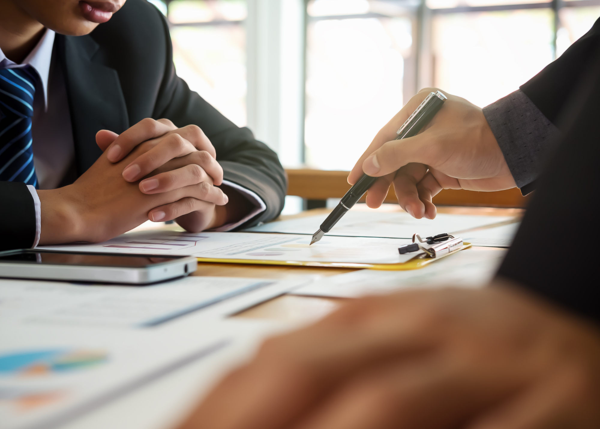 Business professionals reviewing documents together